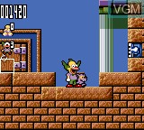 In-game screen of the game Krusty's Fun House on Sega Game Gear